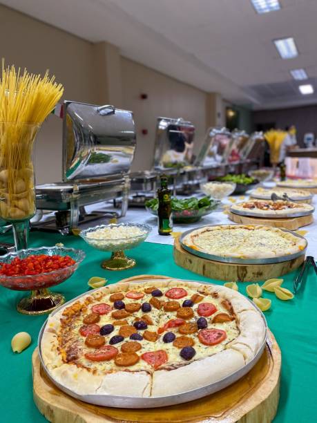 Pizzas organized on the counter