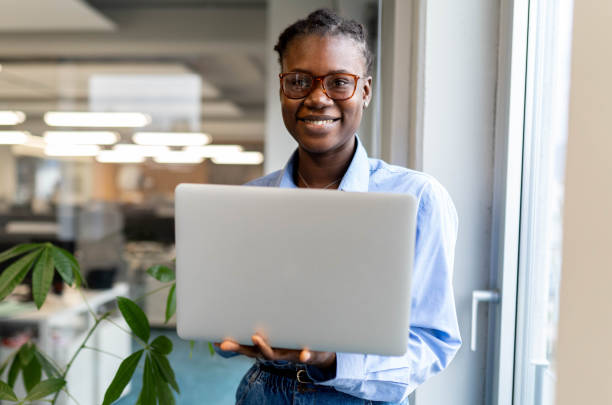 istock Confident female worker stands outside office 2191282292