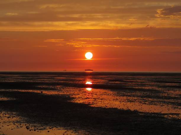 istock Sunset over the sea with ship silhouette. 2191286824
