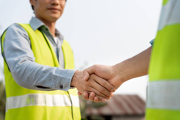 istock Construction team hands shaking greeting start up plan new project contract in office center at construction site, industry ,architecture, partner, teamwork, agreement, property, contacts. 2191288800