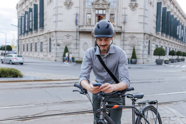 istock Man on the street using phone by the bicycle 2191289127