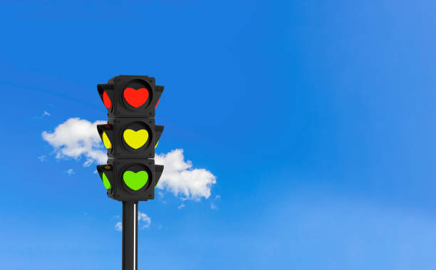 istock Heart-shaped traffic lights against blue sky symbolizing love, creativity, and positivity 2191289673