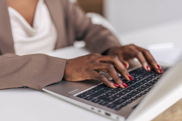 istock Close-up of a woman's hand typing on a keyboard 2191290971