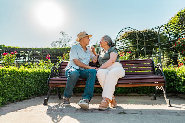 istock Senior couple talking in a public park 2191295630