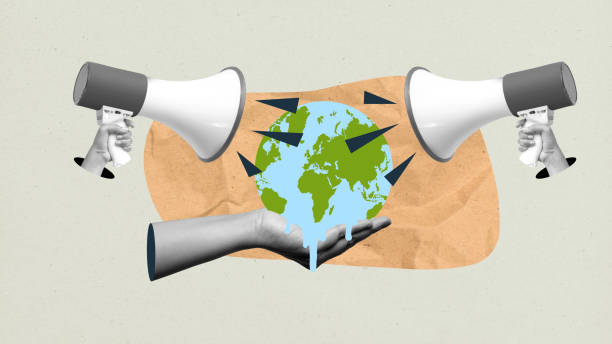 istock Megaphone shouting to a globe on a human hand with a colored background 2191300765