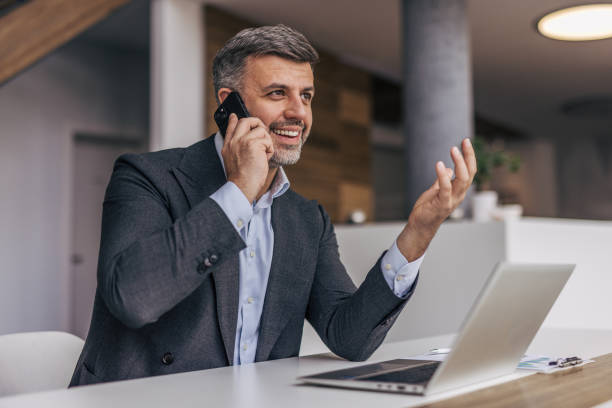 istock Businessman Talking on Phone in Office 2191302814