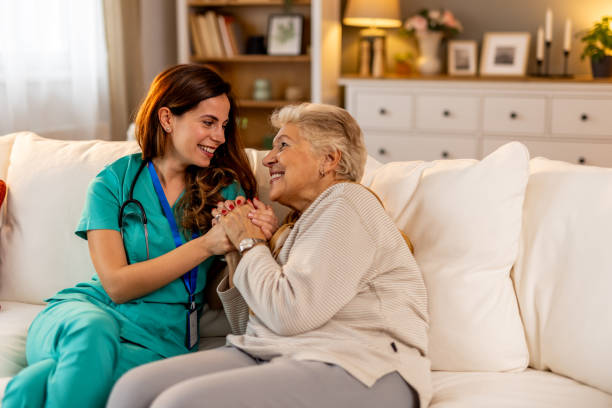 istock Nurse Supporting Elderly Woman with Compassion in Friendly Home Environment 2191305744