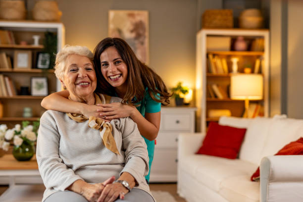 istock Two Women Sharing a Joyful Moment in a Cozy Home Setting 2191305819
