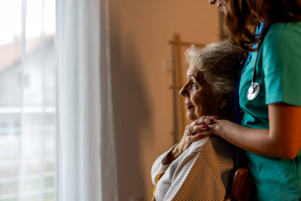 istock Caregiver Supporting Elderly Woman Indoors With Gentle Compassionate Interaction 2191305842