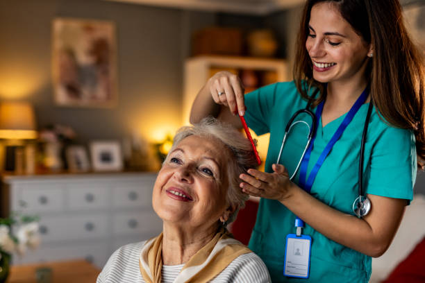 istock Caregiver Assisting Elderly Woman at Home with Warm Interaction 2191305882