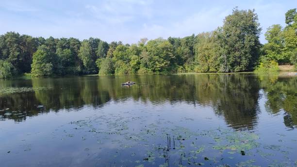 istock People on a sapboard floats on the river 2191307341