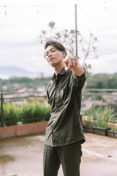 istock Southeast Asian man pointing forward with focus and confidence. 2191309505