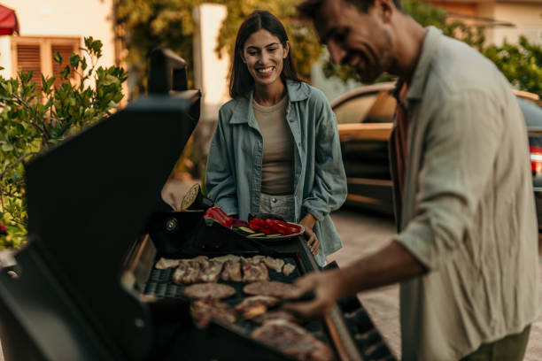 istock Loving couple enjoying BBQ day 2191310535