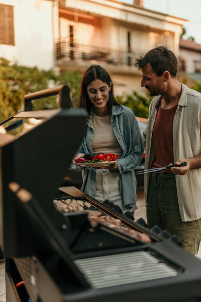 istock Loving couple enjoying BBQ day 2191310571