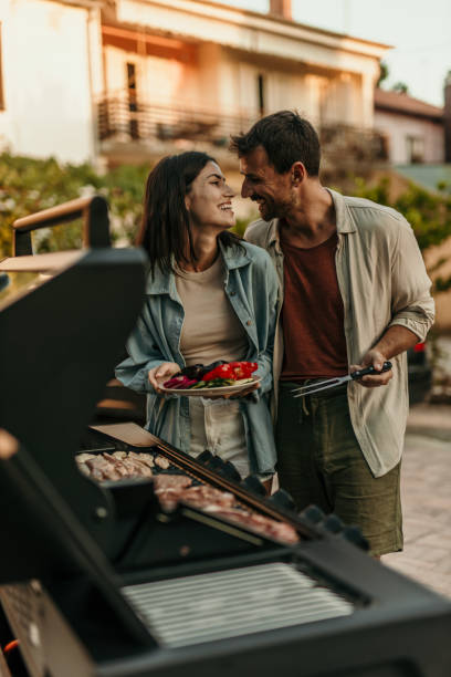 istock Loving couple enjoying BBQ day 2191310572