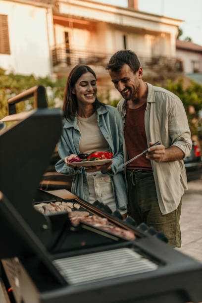 istock Loving couple enjoying BBQ day 2191310587