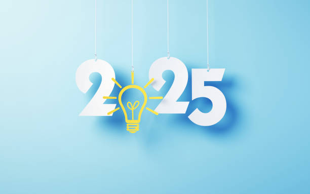 istock Paper Cut 2025 New Year letters with Yellow Light Bulb Hanging on String and Blue soft background 2191311237