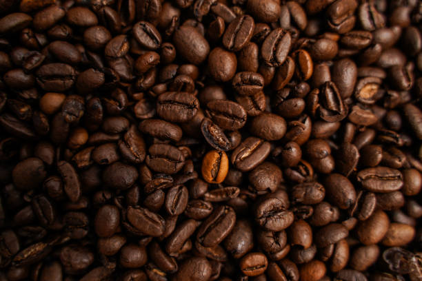 istock Textured background of freshly roasted coffee beans 2191312852
