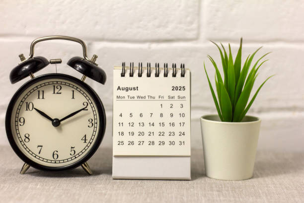 istock August 2025 Alarm Clock and Desk Calendar for Planning on Your Desktop. 2191313759