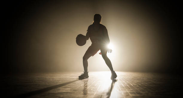 istock Female Basketball Player Silhouette Training 2191315439
