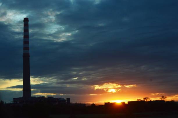 sunset and factory chimney