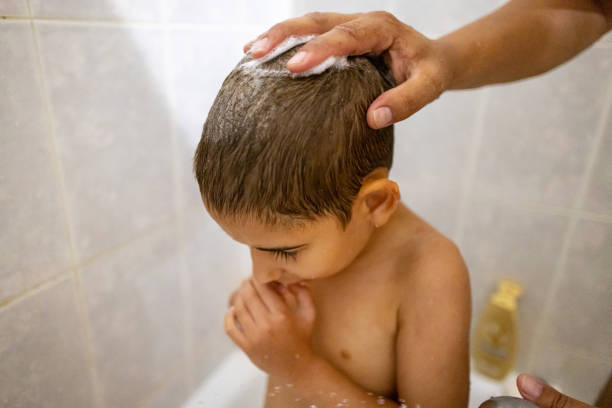 istock Mom Bathes Son After a Beach Day 2191320271