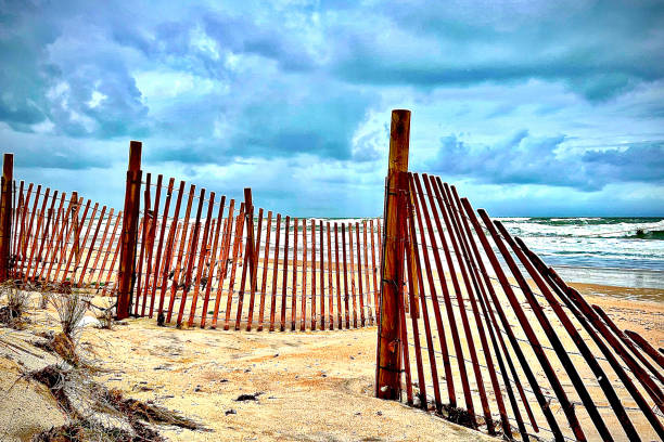 istock Beach Fences hide the angry sea 2191320435