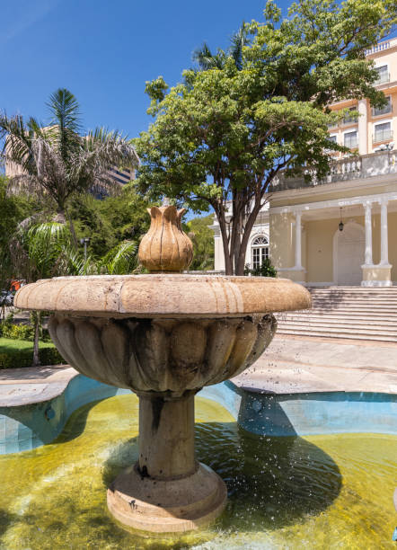 istock Stone Fountain in Lush Garden Setting 2191321359