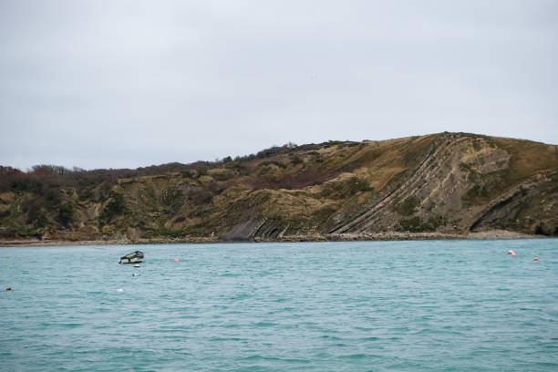 Lulworth Cove and beach view at winter day. Lulworth Cove bay, beach and cliffs view . The Jurassic Coast is a World Heritage Site on the English Channel coast of southern England. Dorset, UK. public beach