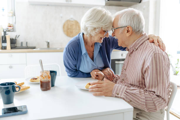 istock Senior couple having romantic moments in kitchen 2191322412