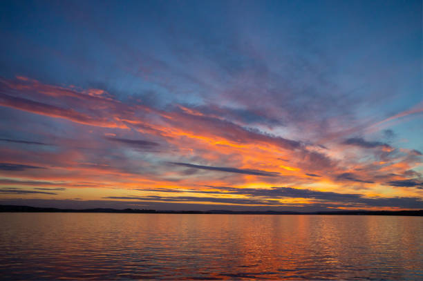 istock Sunset with bright clouds picturesque view of the lake, dramatic sky during sunset. 2191323155