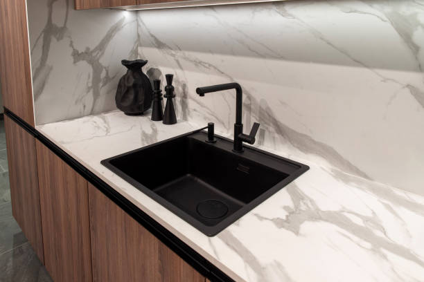 istock Modern black faucet on kitchen workspace with soap dispenser 2191323352