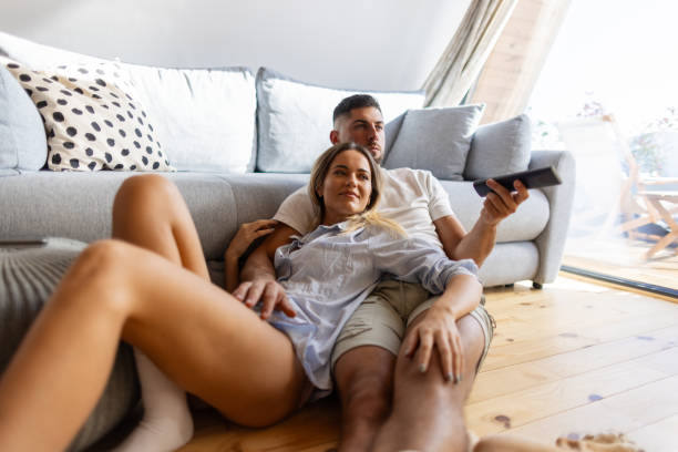 istock Couple relaxing in the living room 2191323637