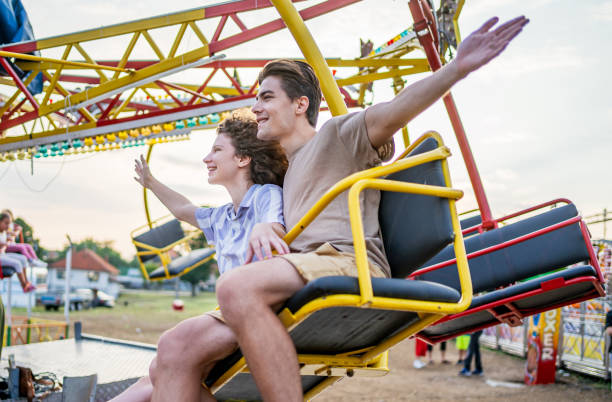 istock Couple having fun in an amusement park 2191324083