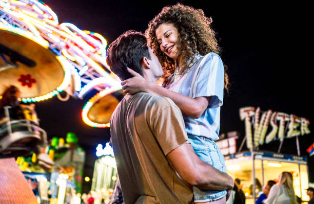 istock Couple having fun in an amusement park 2191324935