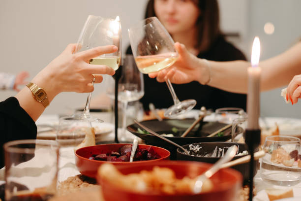 istock Cheese platter with craft cheese assortment and wine glasses at 2191327186