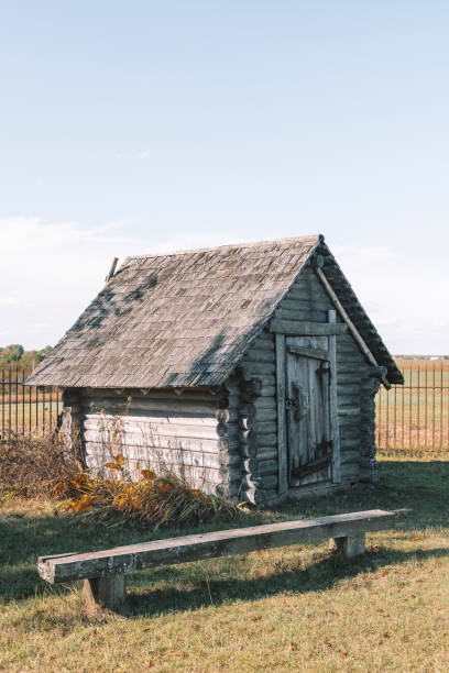 istock Old Rustic wooden log cabin on nature landscape. 2191328179