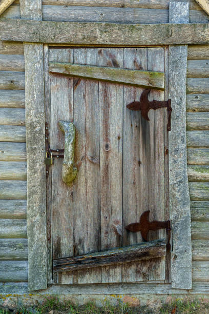 Old Weathered wooden door on rustic house. High quality photo