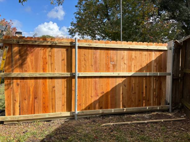istock Installation of a new residential cedar fence using metal posts 2191329087