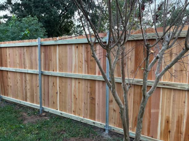 istock Installation of a new residential cedar fence using metal posts 2191329089