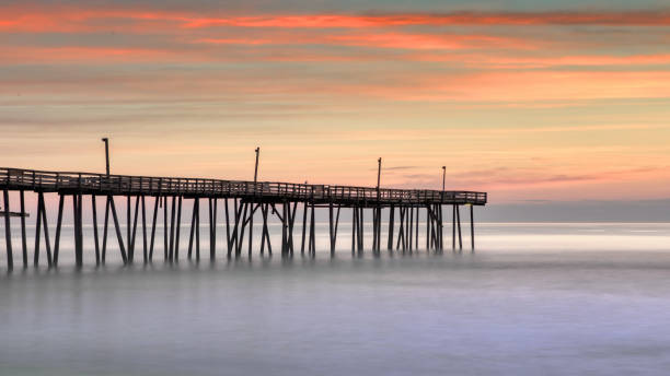 istock Sunrise at Ocean Pier with Calm Waters 2191332604