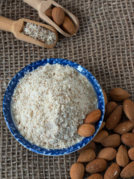 istock Almond flour in a dish placed on rustic background, top view 2191334453
