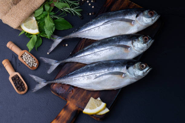 istock Raw mackerel, seafood, ready to cook on black background 2191336002