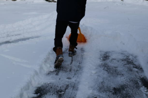 istock Winter Scene Snow Removal Shoveling Snow Snow Storm 2191336015
