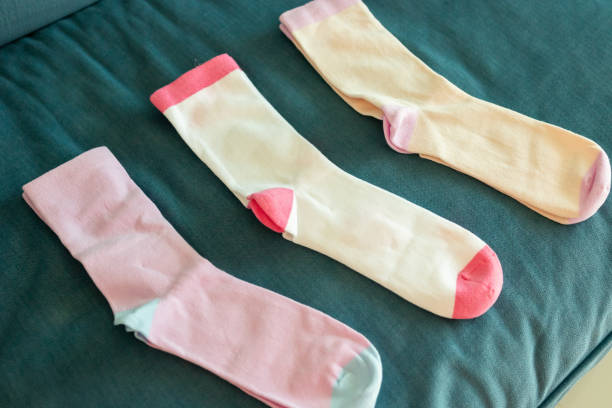 istock Colorful cotton sport socks on blue sofa background 2191336254