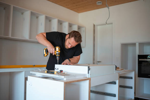 istock Mid Adult Man Installing Kitchen Cabinets 2191337171