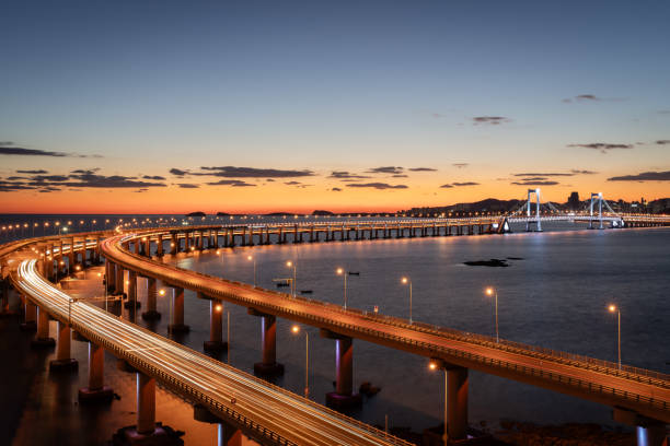 istock The cross-sea bridge over the blue sea surface at sunset. 2191340593