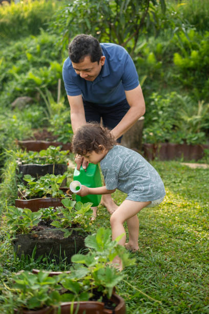 istock Father Gardening With His Son 2191344078