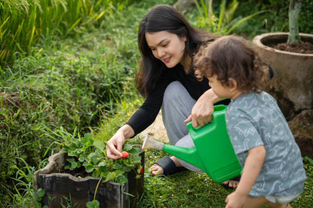 istock Mother Gardening With Her Son 2191344093