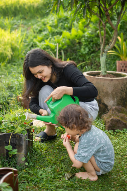 istock Mother Gardening With Her Son 2191344099